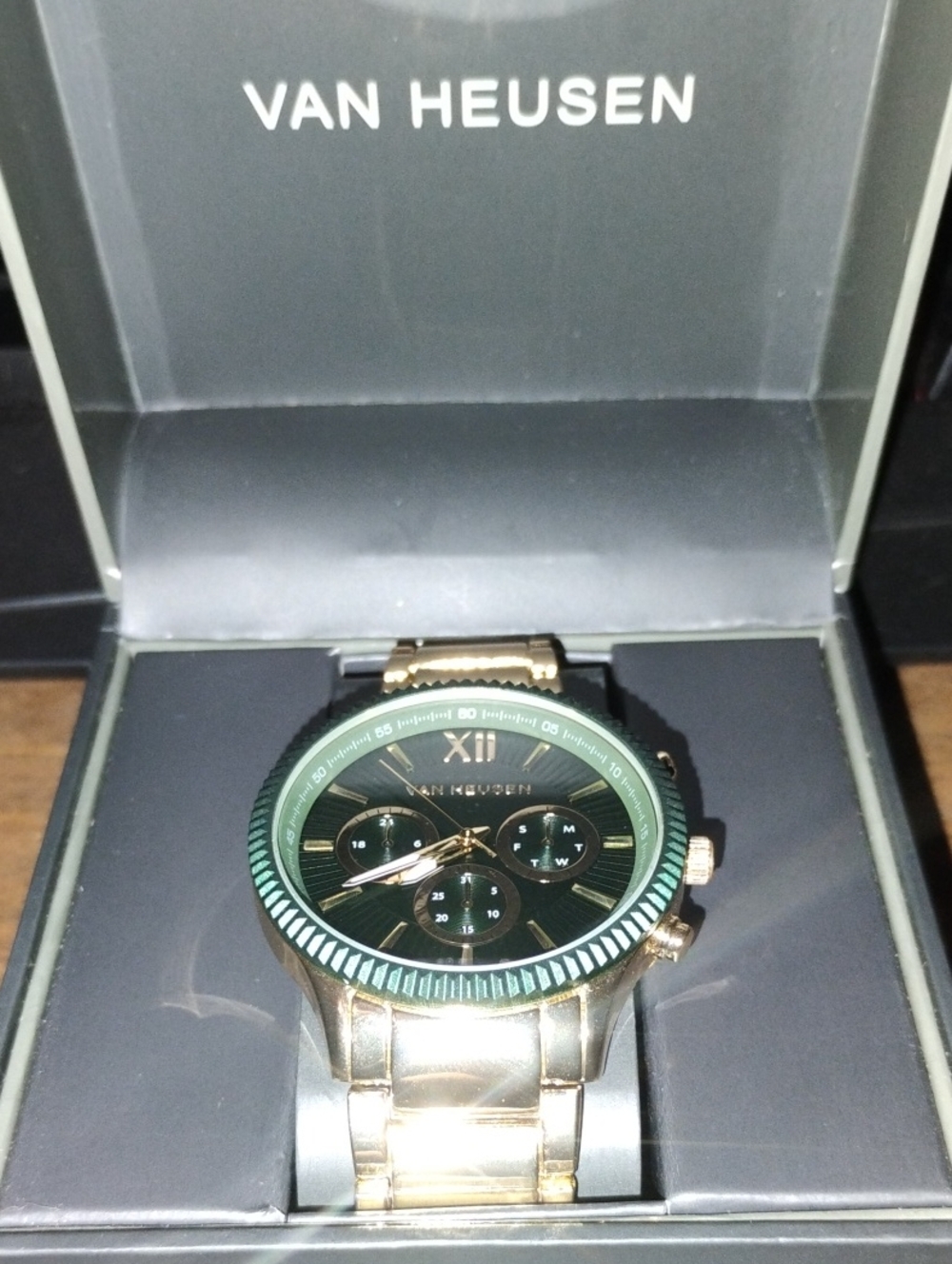 Van Heusen Gold Tone Watch with Green Dial and Bezel